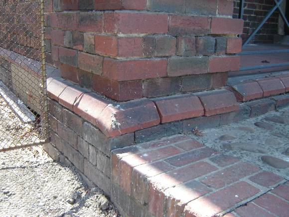 H1343 Existing condition - Exterior, south-east corner, dislodged brickwork and missing mortar.  Dec 2006.