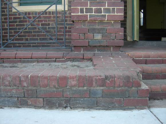 H1343 Exterior - East (front) facade, dislodged brickwork and missing mortar.  Dec 2006.