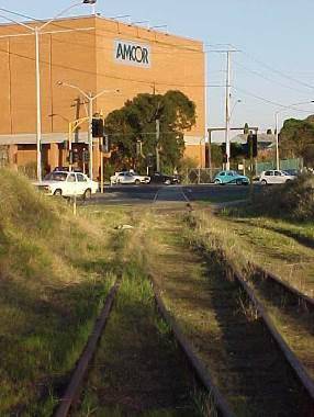 Tracks at the former site of the Fulham Grange Station (now removed) 
approaching the Chandler Highway Bridge.jpg