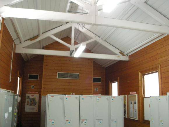 Looking north-east within the Burwood Rd end of the Platform 1 building - the king-post roof trusses abut those of the platform canopy outside the wall to the left