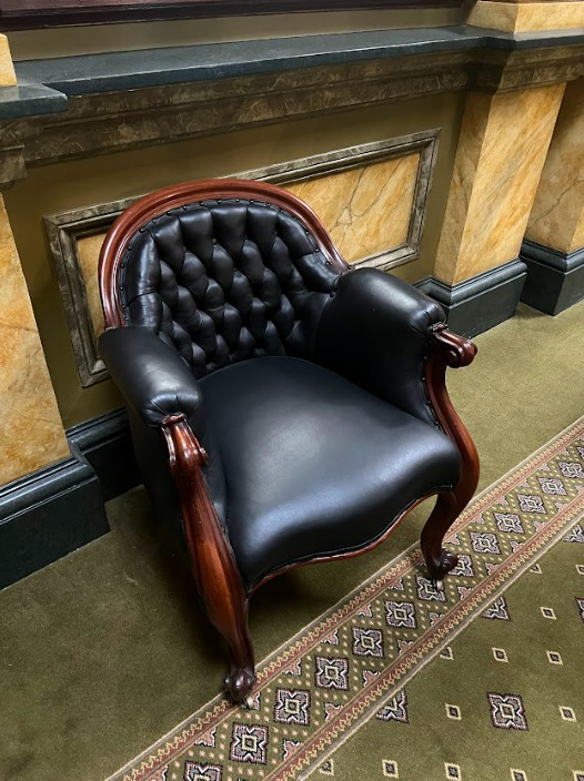 2023. inventory item no. 5, low backed upholstered chair.