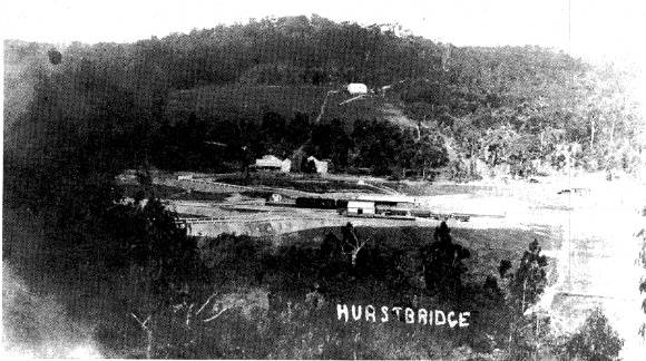 94 - Railways Residence Palm Cypress Trees Hurstbridge_02 - Old photography presumably taken in or soon after 1912 showing the Hurstbridge Railway Station and on the right hand side this house, which predates all of the nearby buildings (ELHPC No.1004) - Shire of Eltham Heritage Study 1992